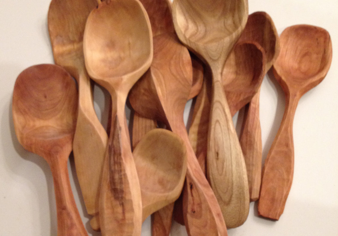group of wooden spoons on white background
