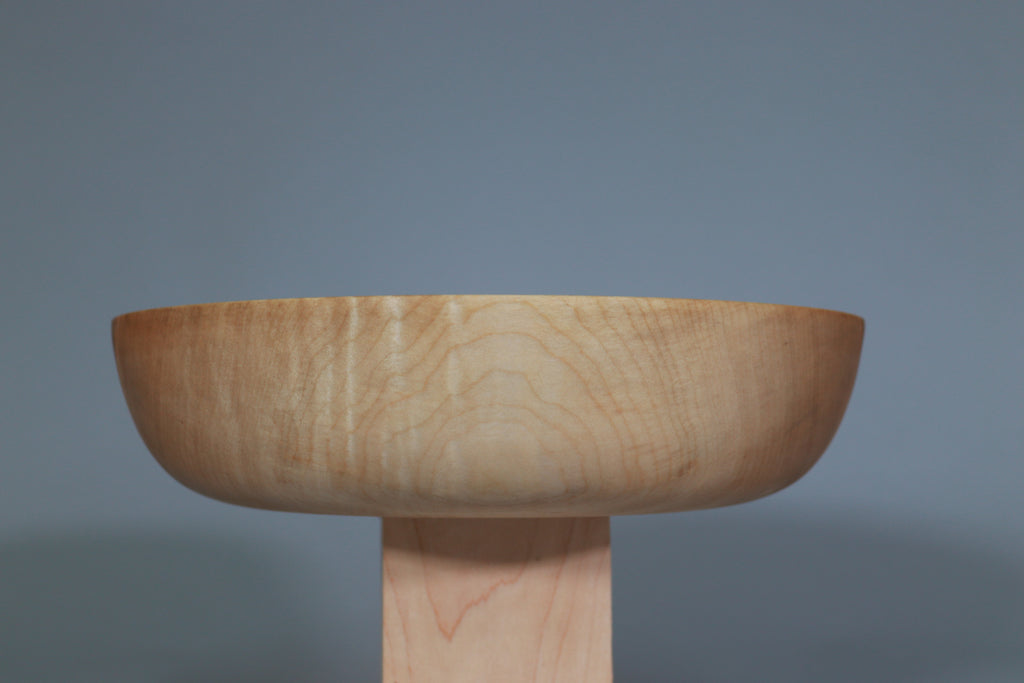 side view of curly maple bowl with emphasis on curly figure