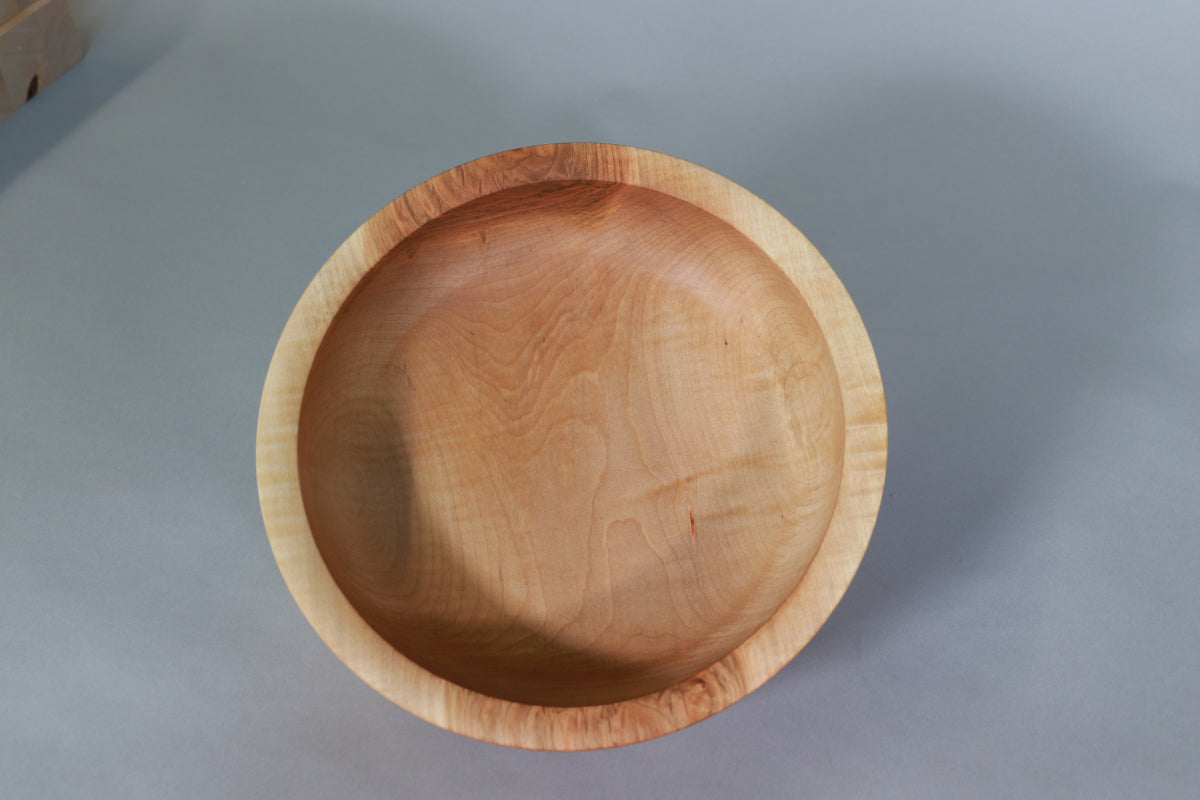 Top view of a maple bowl showing off the curly figure