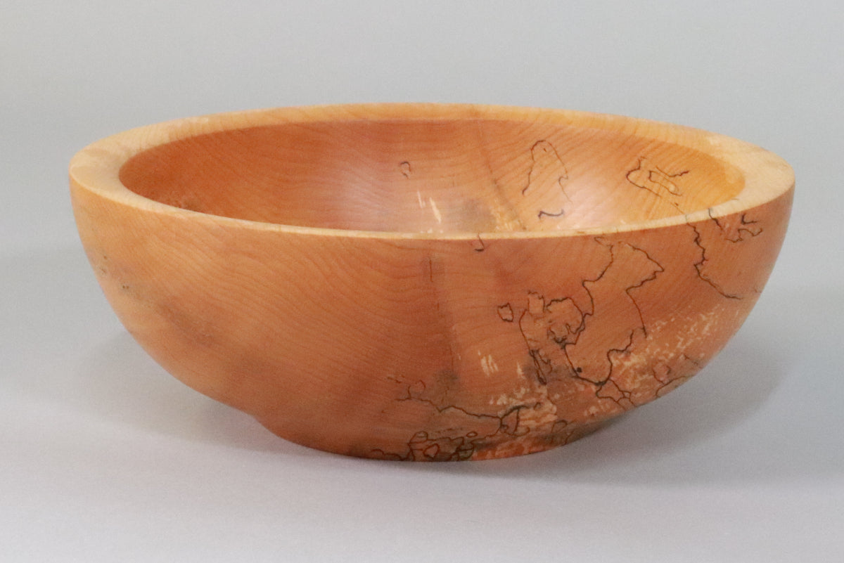 A spalted maple bowl with delicate black spalting lines.