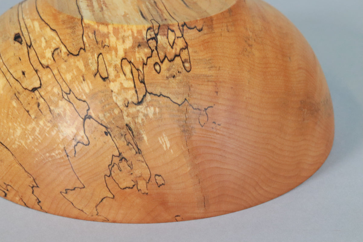 Exterior view of spalted maple bowl showing repaired crack.