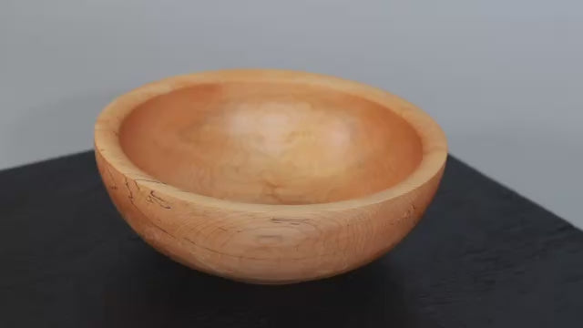 video showing spalted maple bowl rotating.